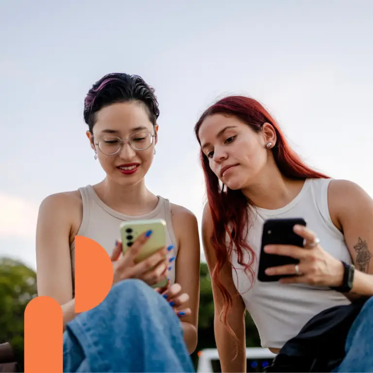 Two girls holding phones